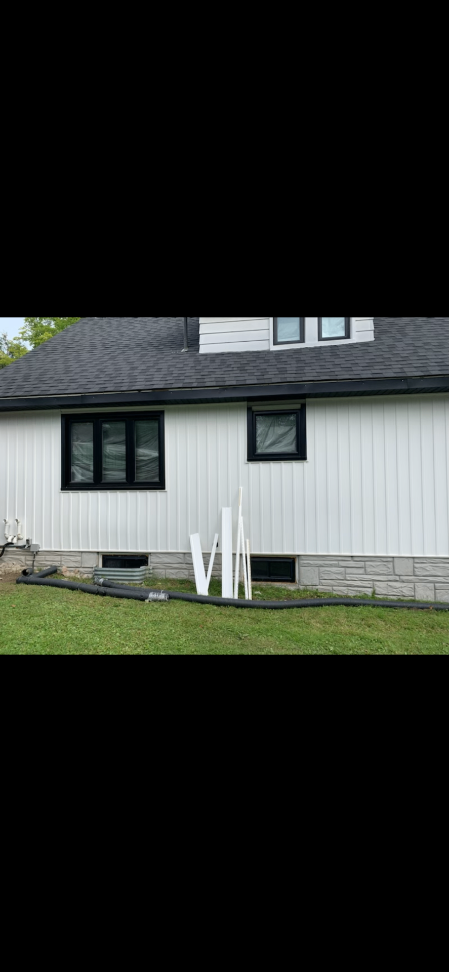 White Siding & Stone Skirt